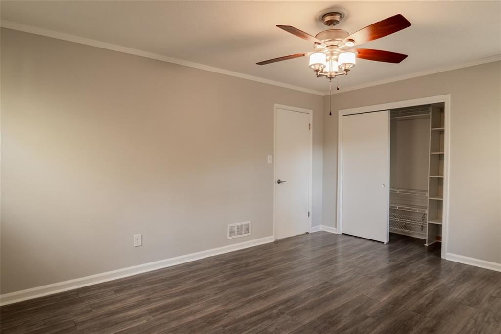 3599 Lower Roswell Road Marietta, GA 30068 - Photo 30 of 64 a view of an empty room with wooden floor