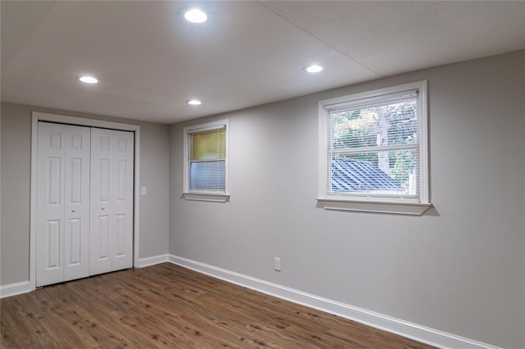 3599 Lower Roswell Road Marietta, GA 30068 - Photo 39 of 64 a view of empty room with wooden floor and fan