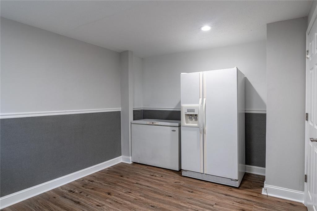 3599 Lower Roswell Road Marietta, GA 30068 - Photo 45 of 64 a kitchen with a refrigerator and a stove top oven