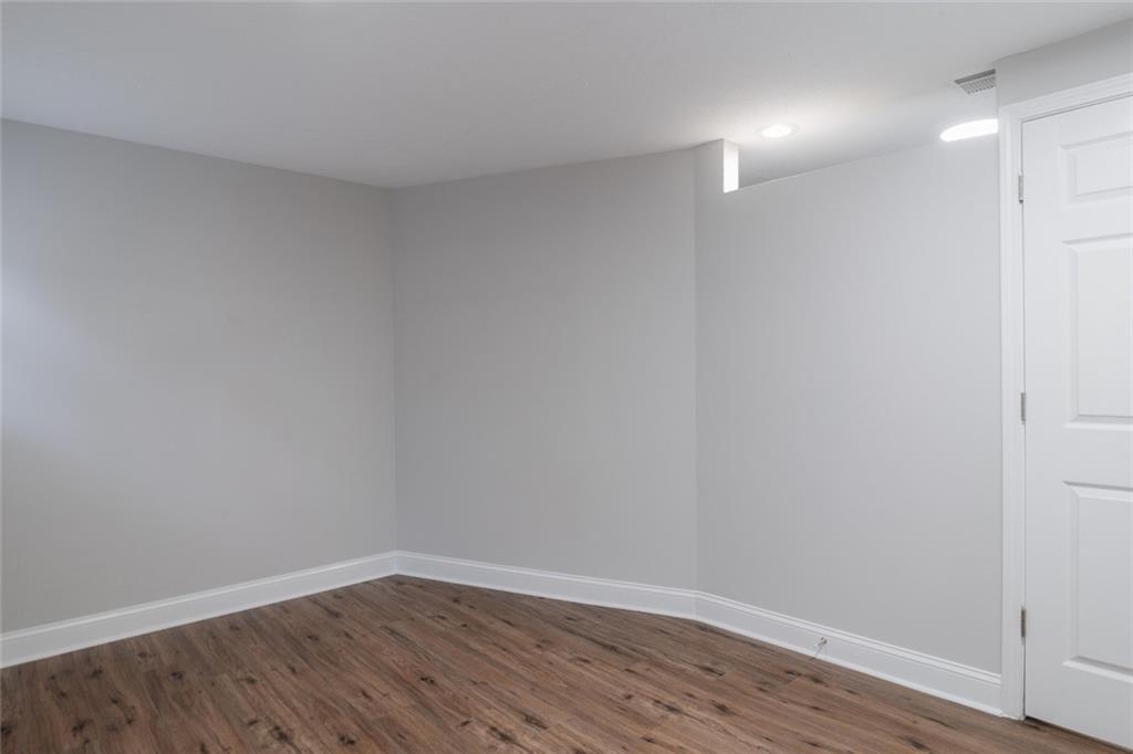 3599 Lower Roswell Road Marietta, GA 30068 - Photo 48 of 64 a view of an empty room with wooden floor