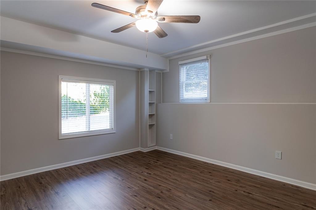 3599 Lower Roswell Road Marietta, GA 30068 - Photo 54 of 64 a view of an empty room with wooden floor and a window