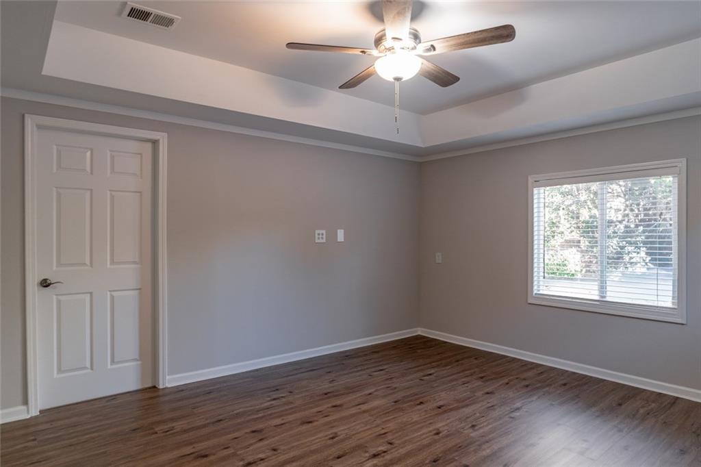 3599 Lower Roswell Road Marietta, GA 30068 - Photo 55 of 64 wooden floor in an empty room with a window
