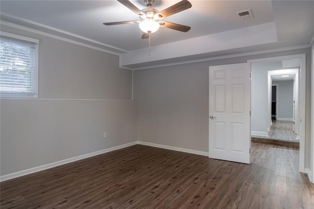 3599 Lower Roswell Road Marietta, GA 30068 - Photo 59 of 64 wooden floor in an empty room with a window