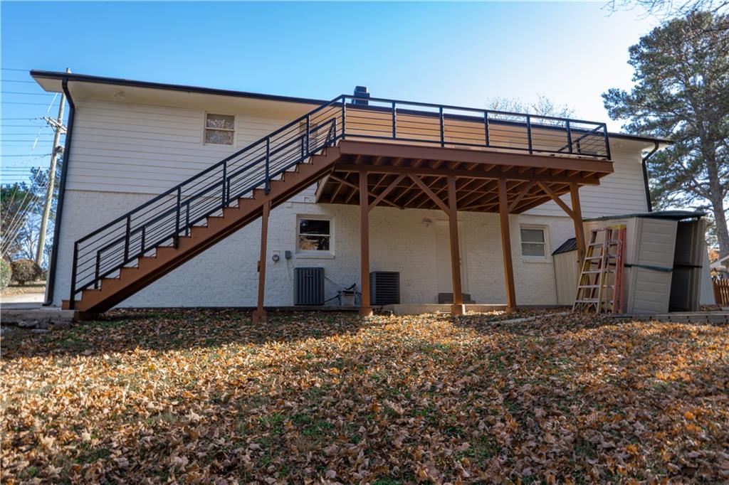3599 Lower Roswell Road Marietta, GA 30068 - Photo 10 of 64 a view of a house with wooden fence