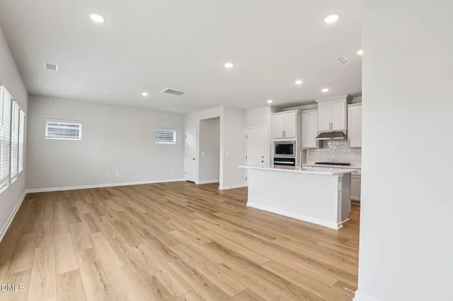 a view of kitchen with wooden floor