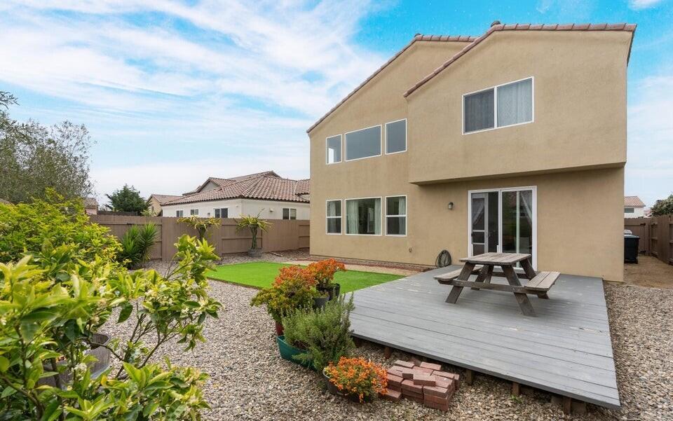 4575 Castillo Drive Guadalupe, CA 93434 - Photo 16 of 24 a view of a patio with table and chairs under an umbrella