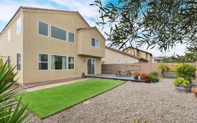 a view of a backyard with a garden and plants