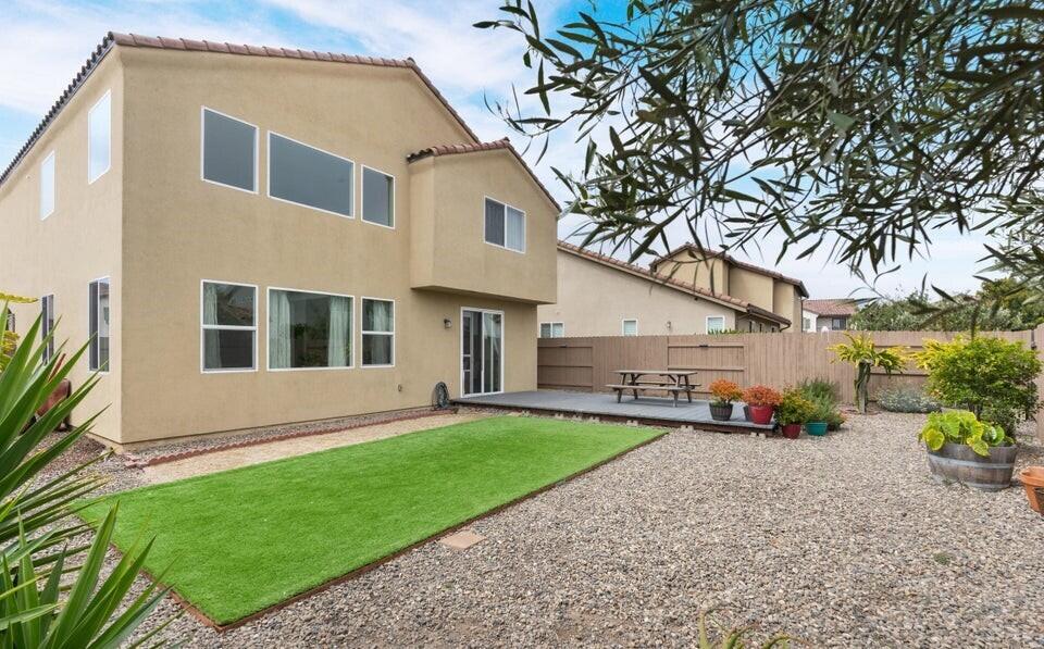 4575 Castillo Drive Guadalupe, CA 93434 - Photo 17 of 24 a front view of a house with a yard and garage