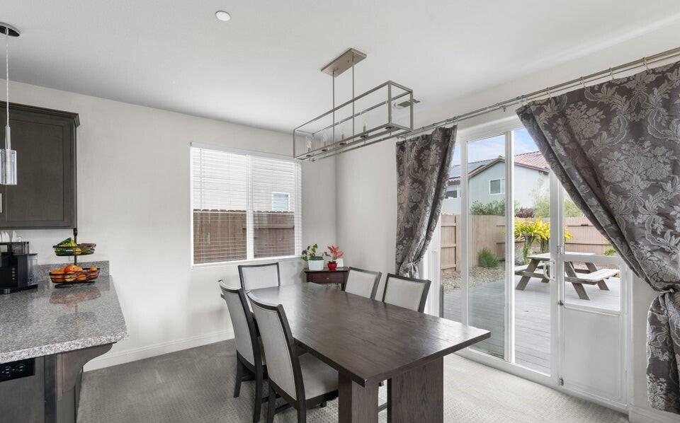 4575 Castillo Drive Guadalupe, CA 93434 - Photo 10 of 24 a dining room with furniture a chandelier and wooden floor