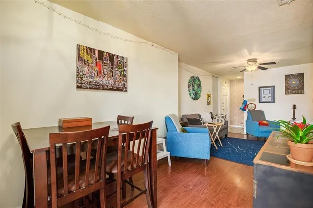 a view of a livingroom with furniture and wooden floor