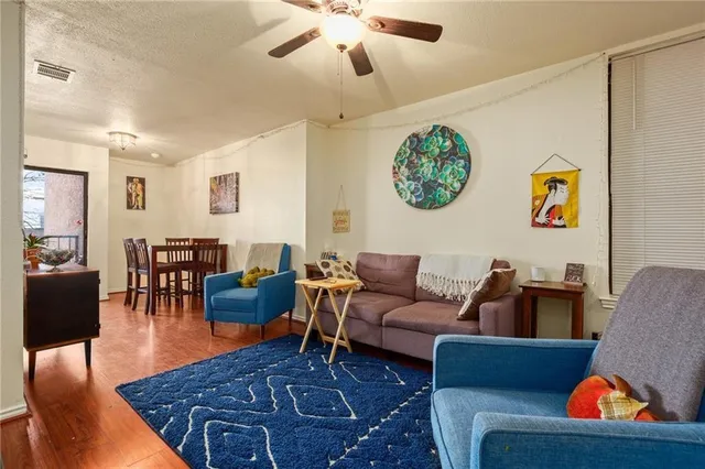 a living room with furniture and a rug