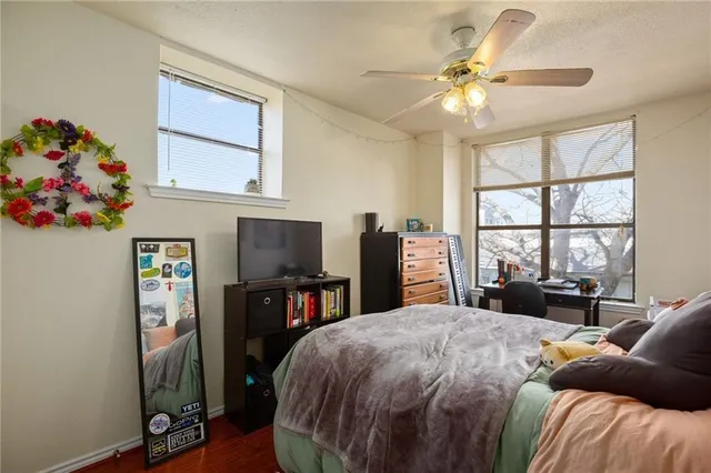 a bed room with a bed and a chandelier