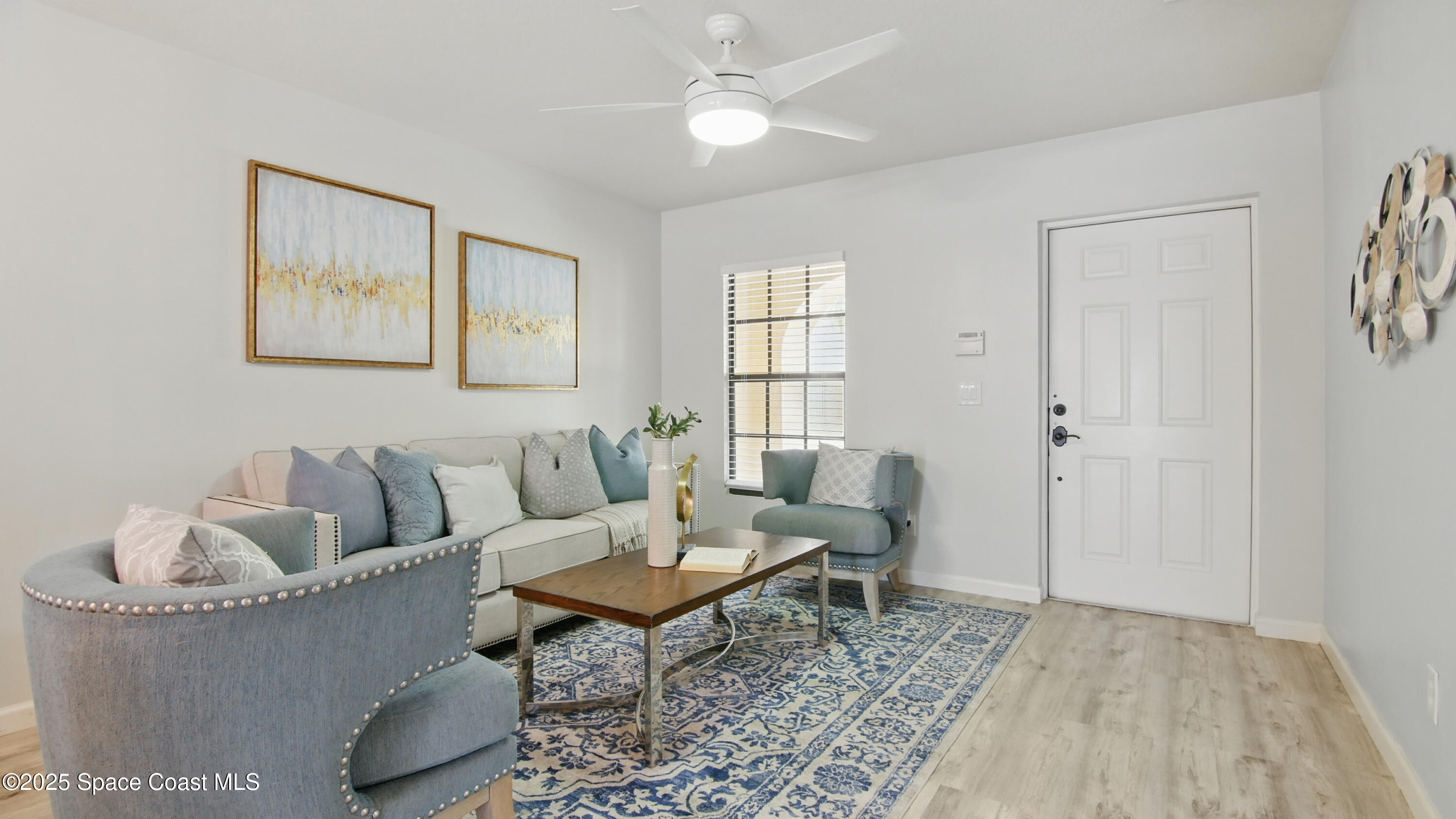 1160 Luminary Circle, Unit 105 Melbourne, FL 32901 - Photo 4 of 16 a living room with furniture and a window