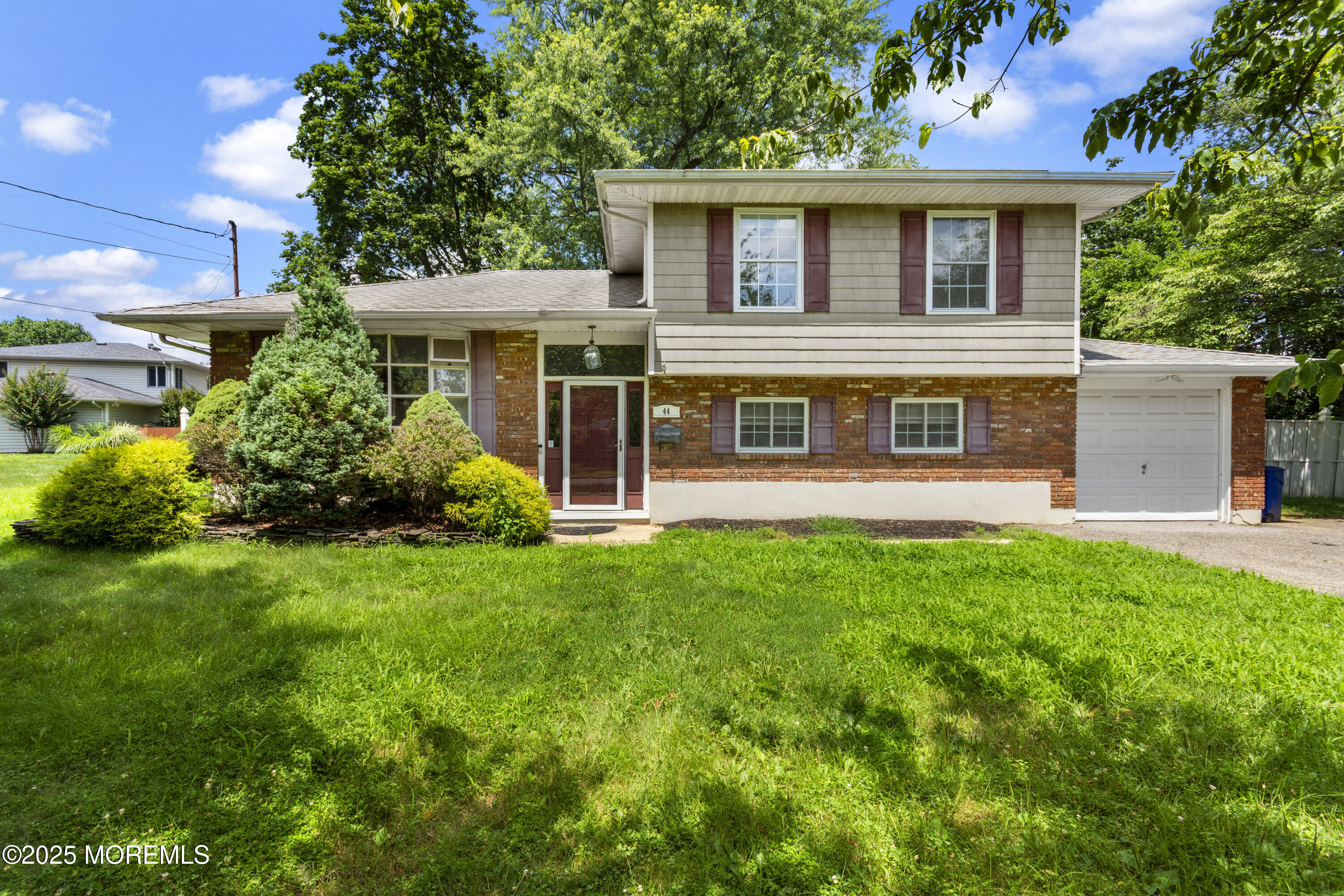 44 Koenig Lane Freehold, NJ 07728 - Photo 1 of 22 front view of a house with a yard