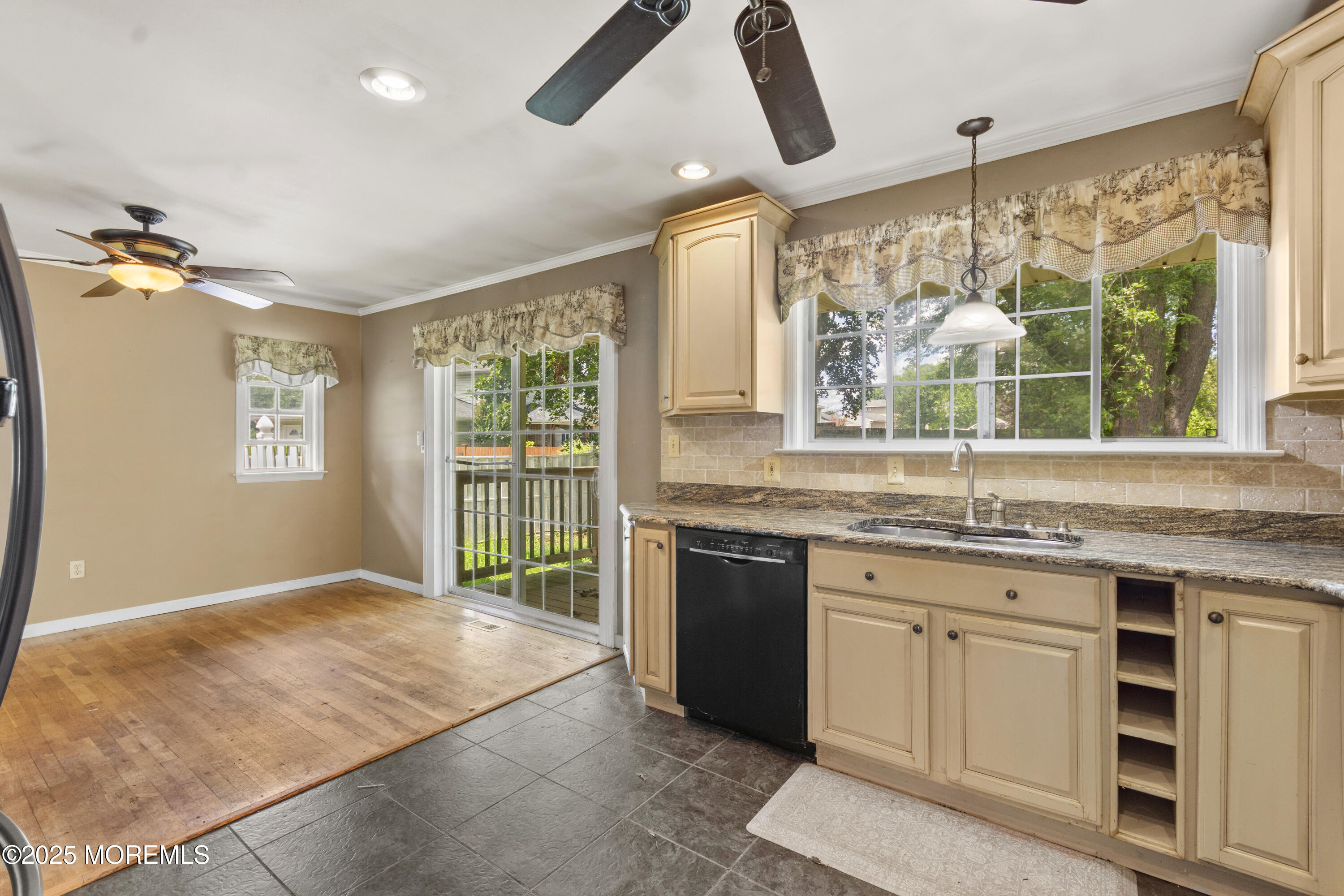 44 Koenig Lane Freehold, NJ 07728 - Photo 11 of 22 a kitchen with granite countertop a stove a sink and a refrigerator