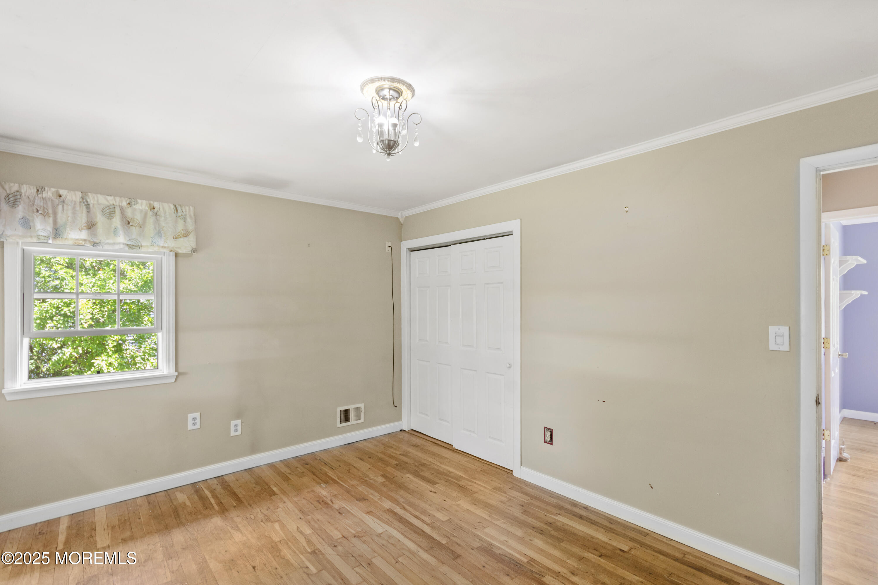 44 Koenig Lane Freehold, NJ 07728 - Photo 17 of 22 a view of an empty room with a window