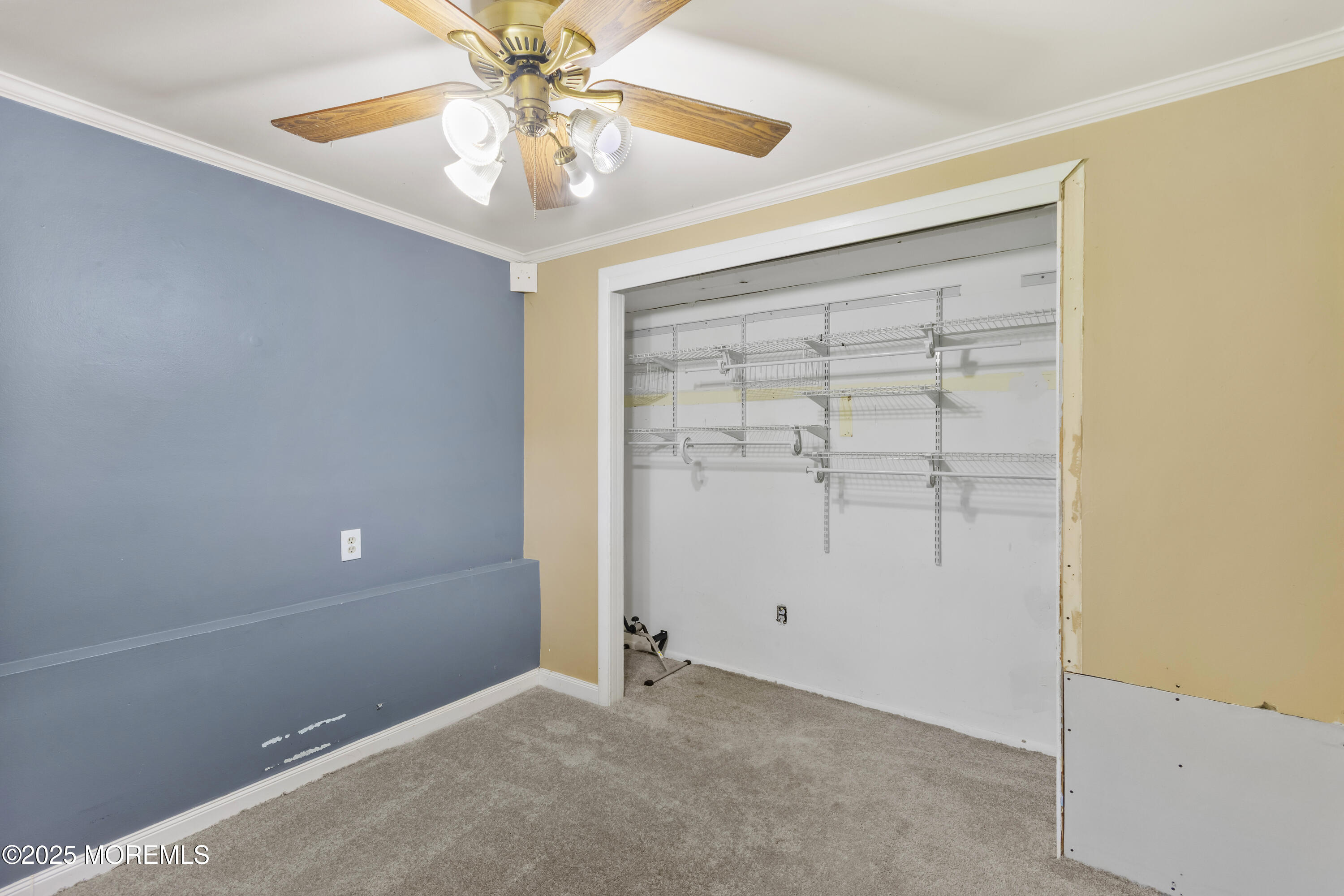44 Koenig Lane Freehold, NJ 07728 - Photo 19 of 22 an empty room with windows and fan