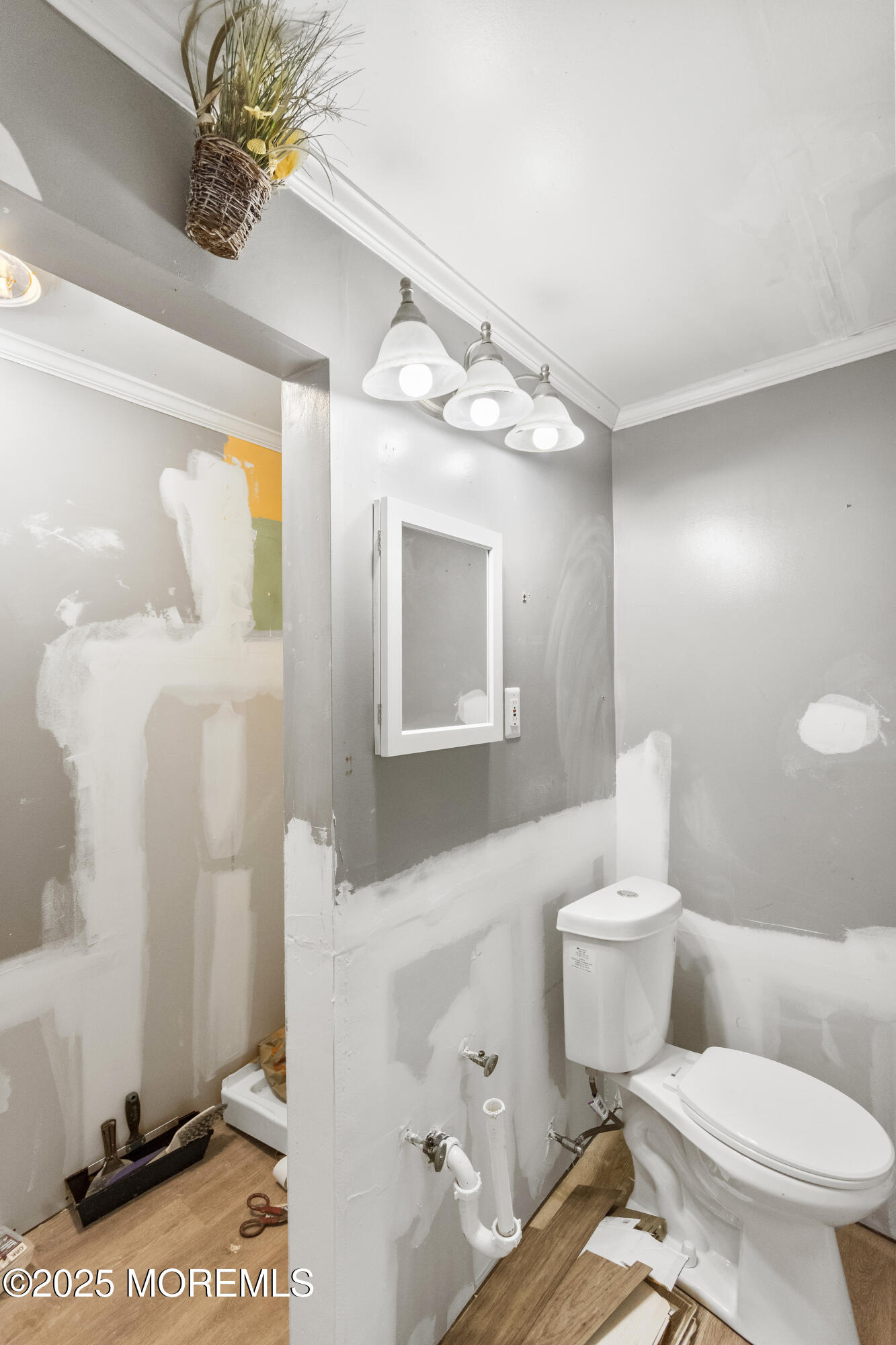 44 Koenig Lane Freehold, NJ 07728 - Photo 20 of 22 a white toilet sitting next to a bathroom sink and vanity