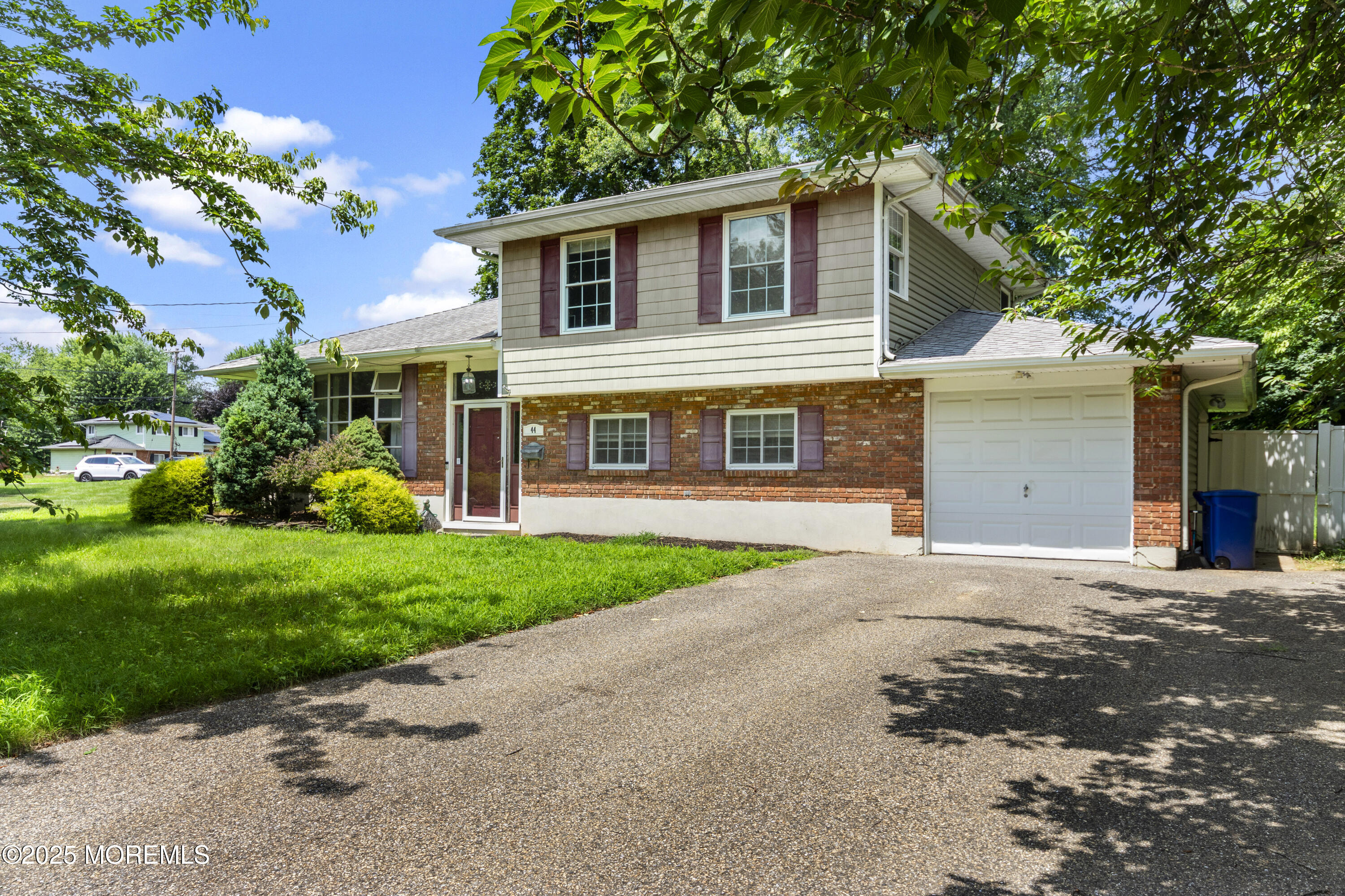 44 Koenig Lane Freehold, NJ 07728 - Photo 2 of 22 front view of a house with a yard
