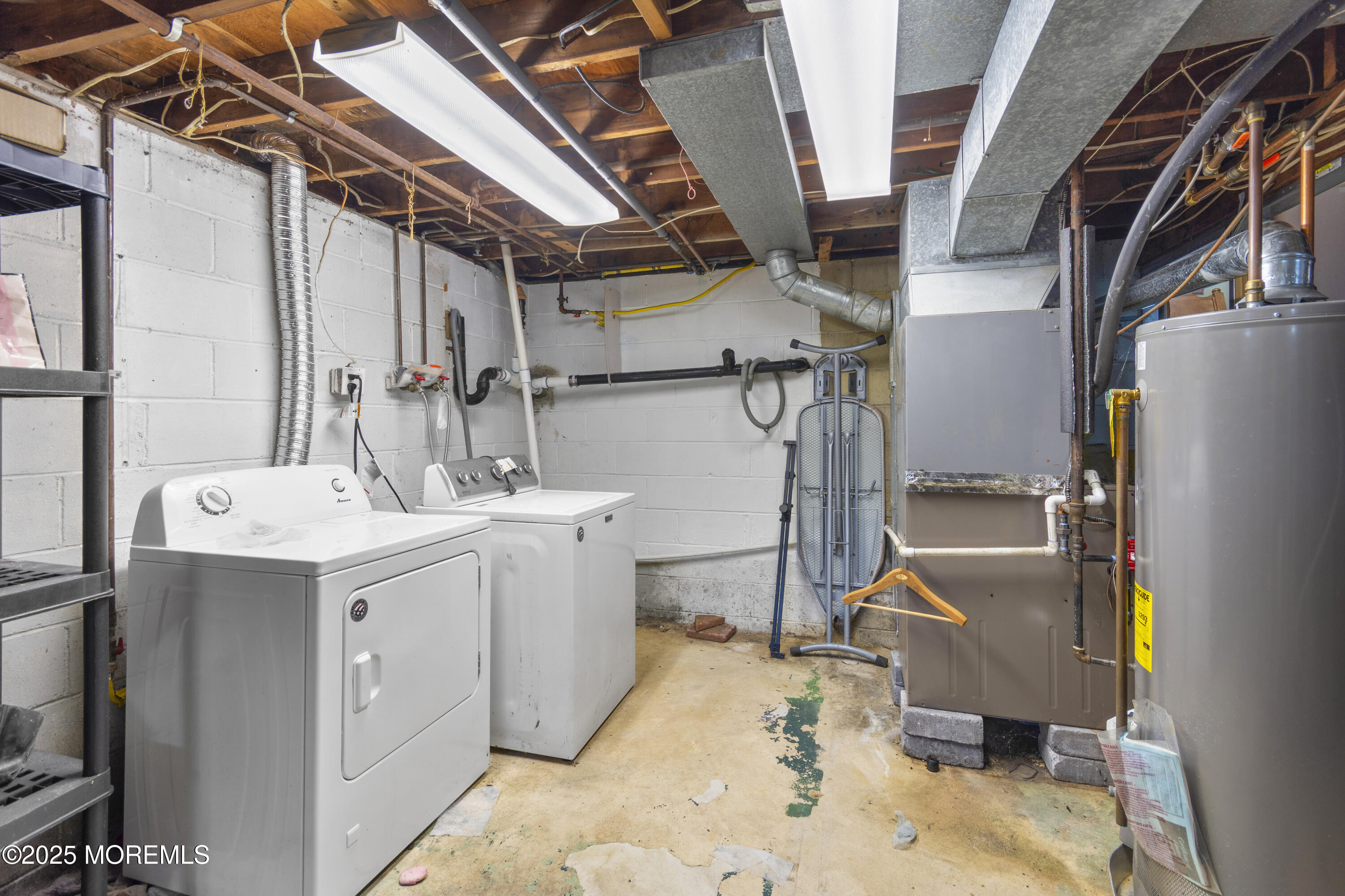 44 Koenig Lane Freehold, NJ 07728 - Photo 22 of 22 a utility room with dryer and washer