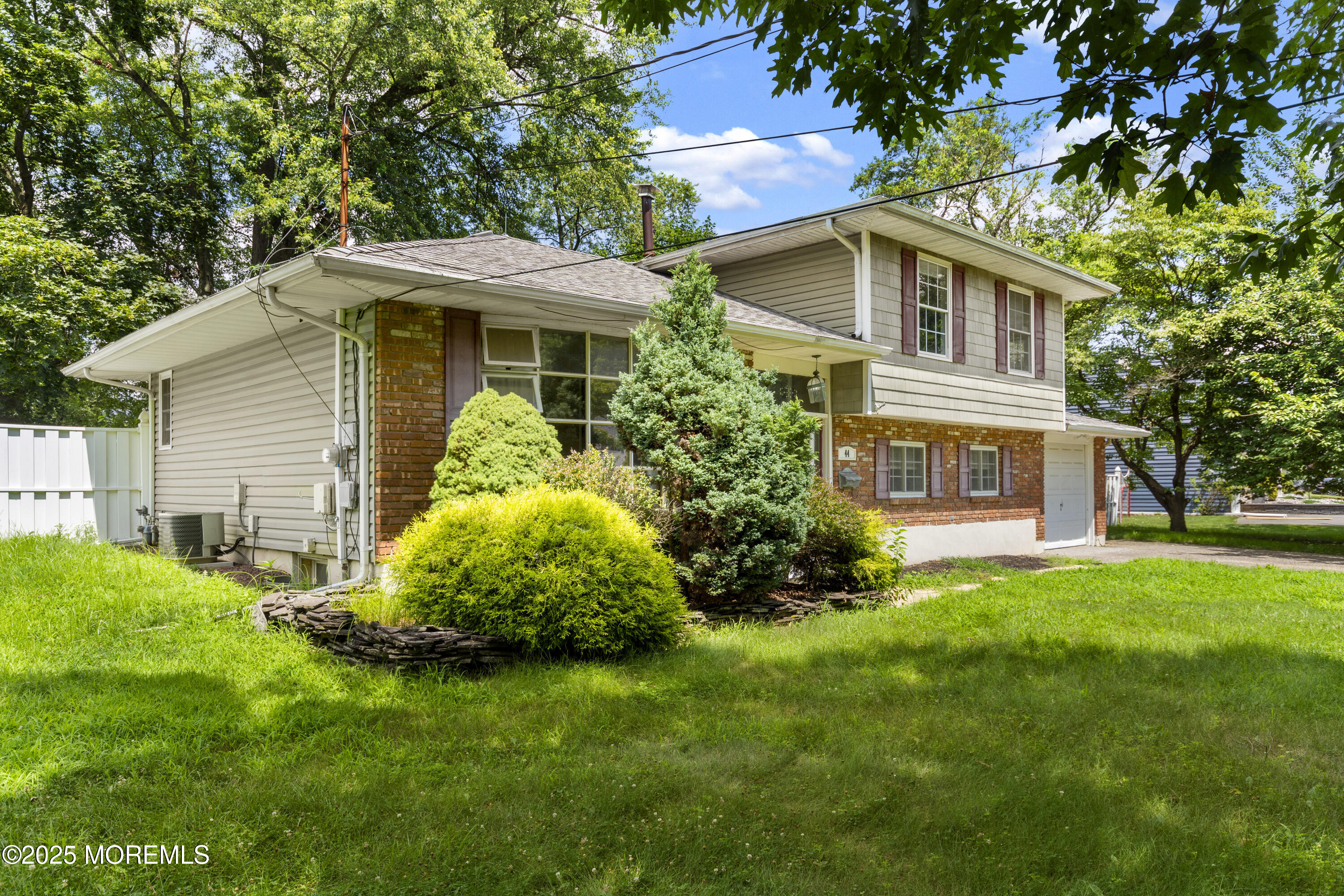 44 Koenig Lane Freehold, NJ 07728 - Photo 3 of 22 a front view of a house with a garden