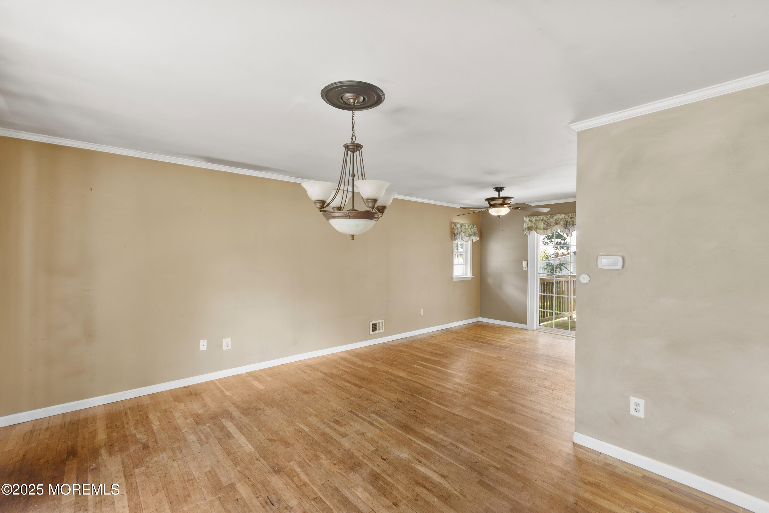 44 Koenig Lane Freehold, NJ 07728 - Photo 7 of 22 a view of empty room with wooden floor