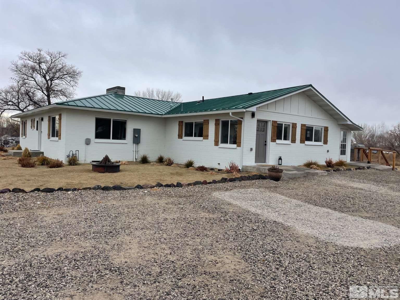 3900 Alcorn Road Fallon, NV 89406 - Photo 40 of 40 a front view of a house with a yard