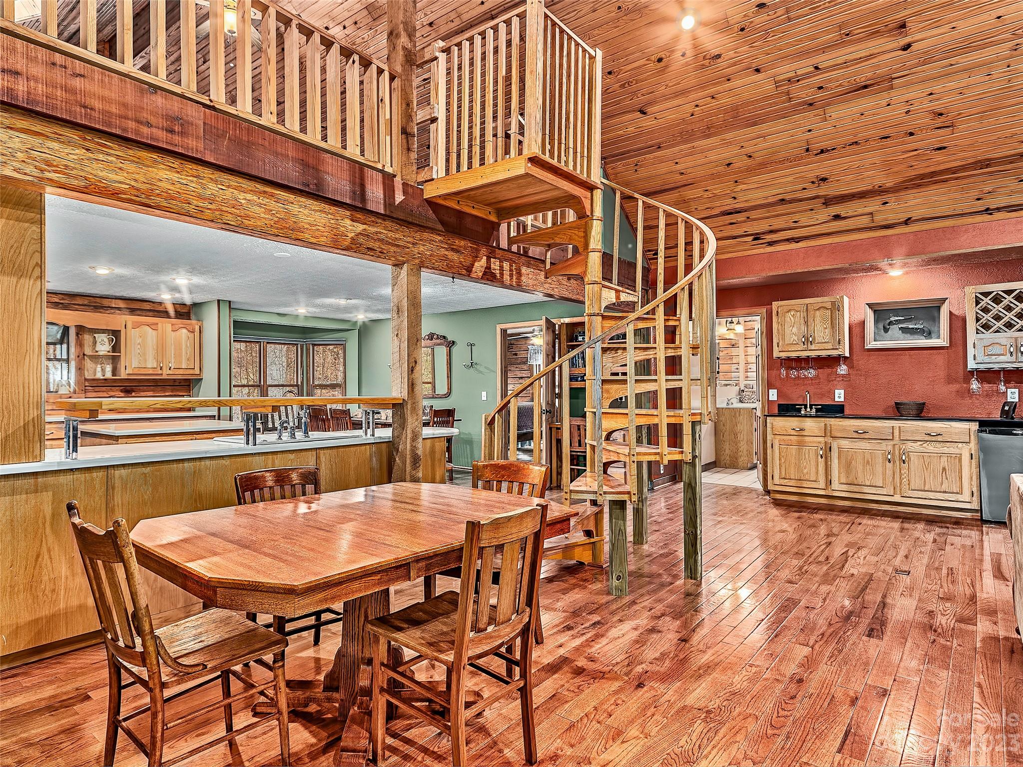 32 Magic Mountain Road Candler, NC 28715 - Photo 11 of 44 a dining table with chairs and outdoor view