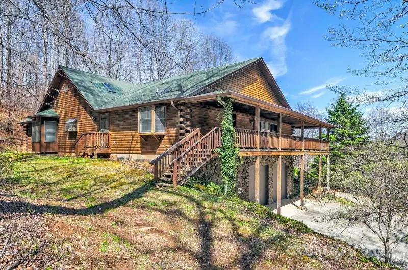 32 Magic Mountain Road Candler, NC 28715 - Photo 2 of 44 a view of a house with a yard