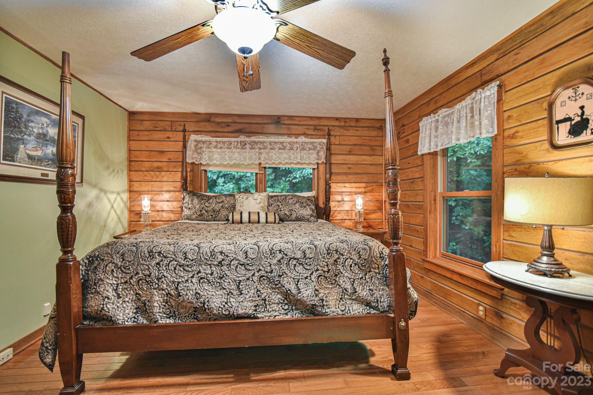 32 Magic Mountain Road Candler, NC 28715 - Photo 31 of 44 a bed sitting in a bedroom next to a window