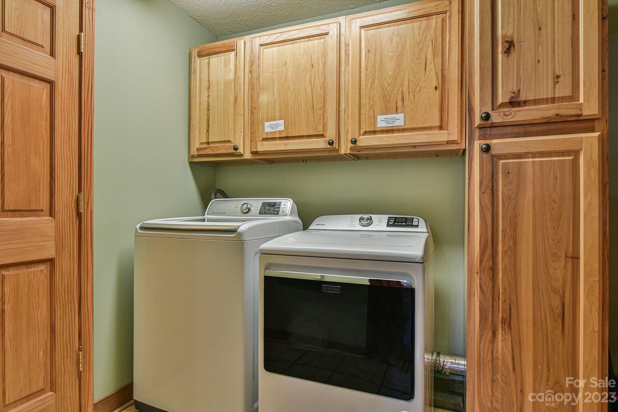 32 Magic Mountain Road Candler, NC 28715 - Photo 35 of 44 a utility room with dryer and washer