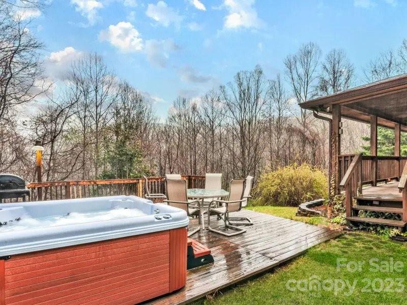 32 Magic Mountain Road Candler, NC 28715 - Photo 4 of 44 a view of a patio with swimming pool