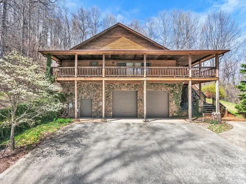 32 Magic Mountain Road Candler, NC 28715 - Photo 43 of 44 a front view of a house with a garden