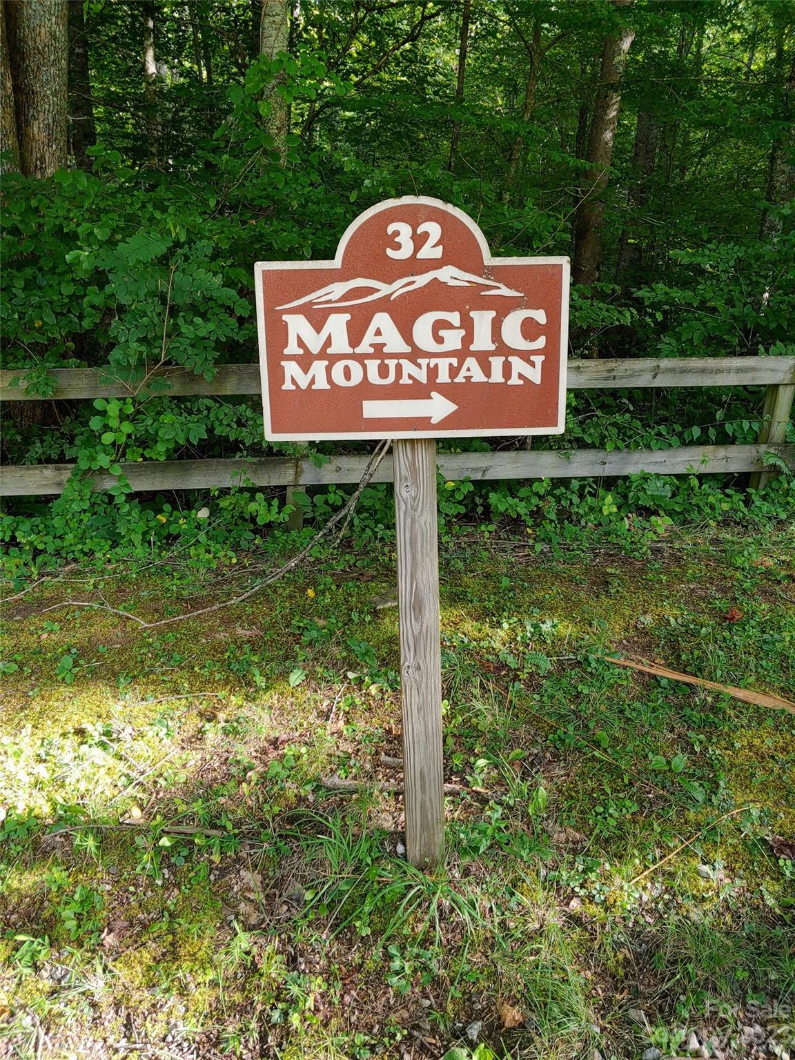 32 Magic Mountain Road Candler, NC 28715 - Photo 44 of 44 a sign that is sitting on a brick wall