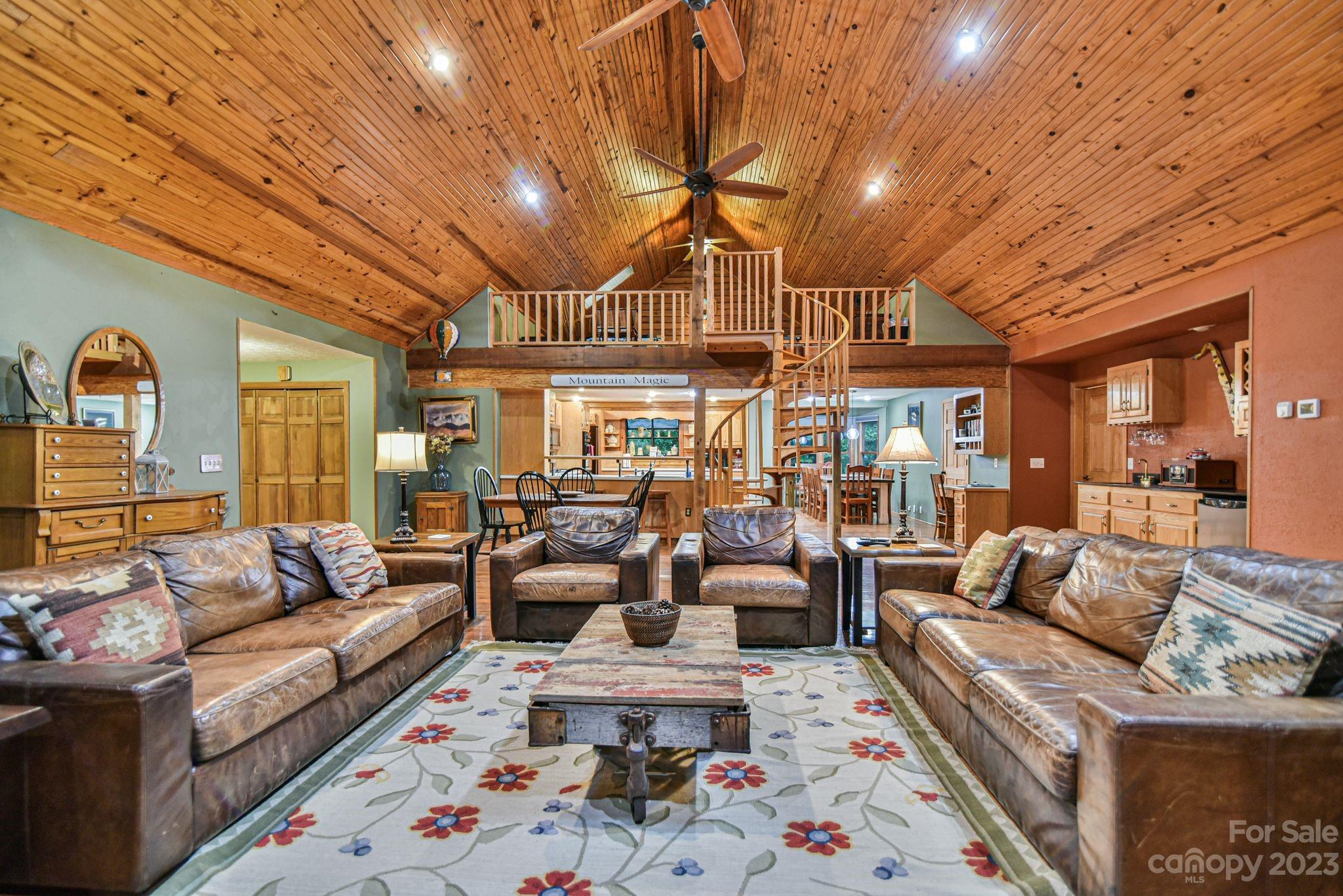 32 Magic Mountain Road Candler, NC 28715 - Photo 10 of 44 a living room with furniture and wooden floor