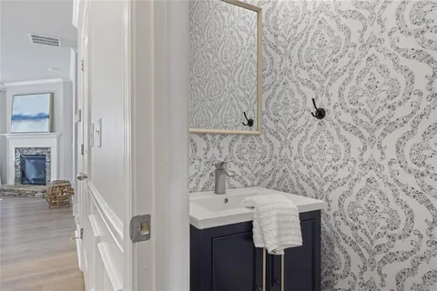 a bathroom with a sink and mirror