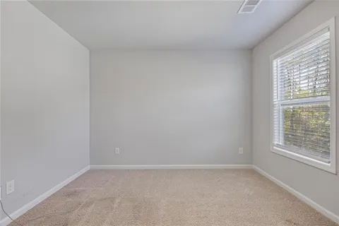 a view of a room that has a window in it