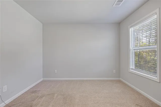 a view of a room that has a window in it