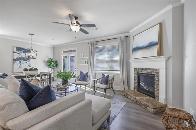a living room with furniture and a fireplace
