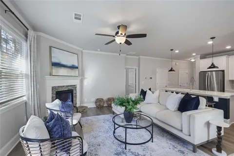 a living room with furniture and a fireplace