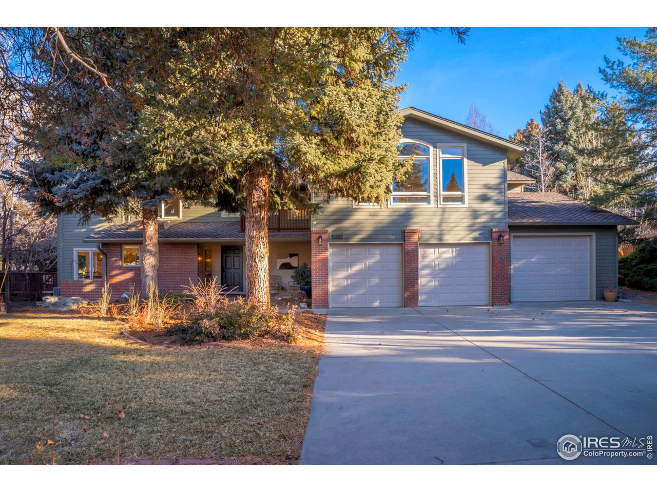 5332 Spotted Horse Trail Boulder, CO 80301 - Photo 1 of 40 a front view of a house with garden