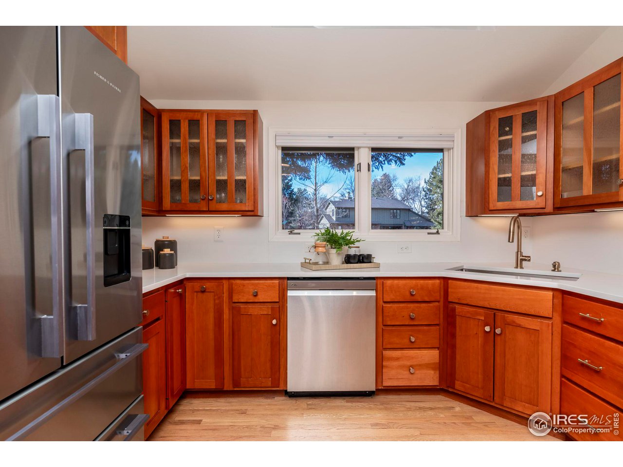 5332 Spotted Horse Trail Boulder, CO 80301 - Photo 12 of 40 a kitchen with stainless steel appliances granite countertop a refrigerator and a stove top oven