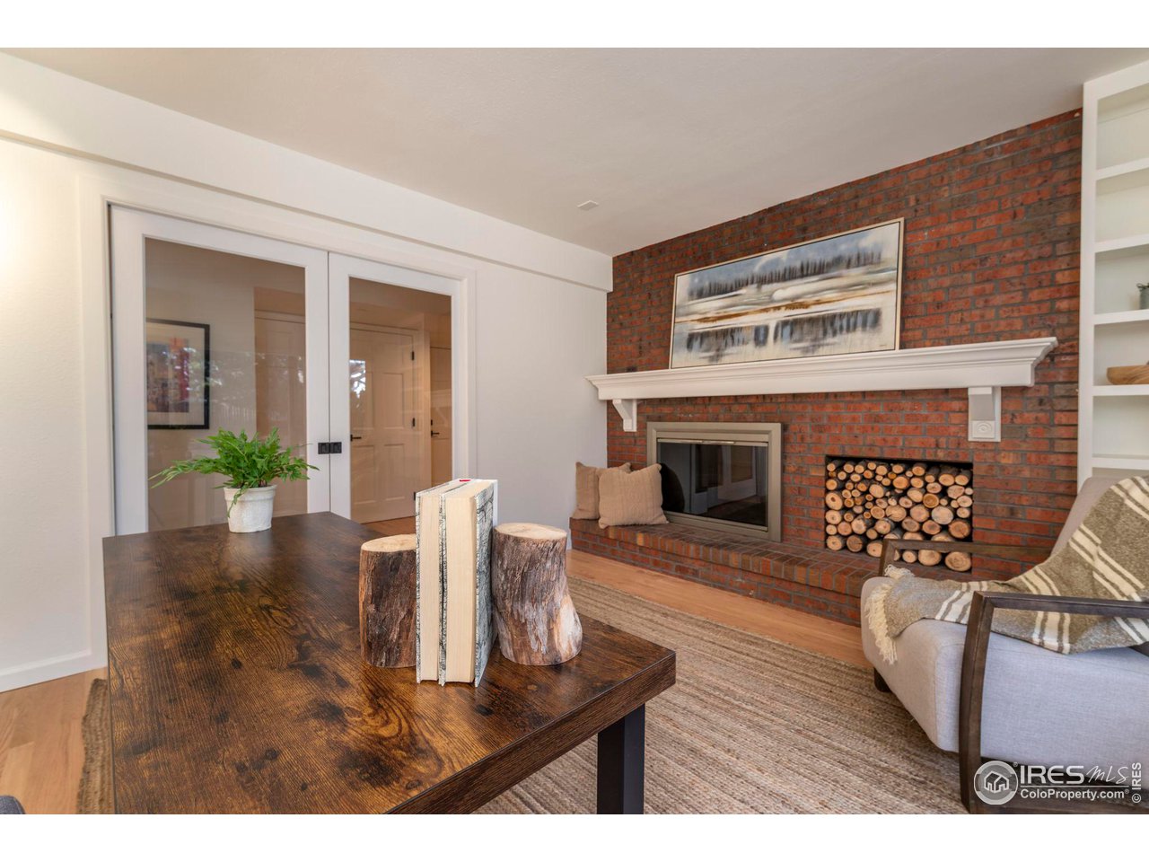 5332 Spotted Horse Trail Boulder, CO 80301 - Photo 17 of 40 a living room with furniture and a fireplace