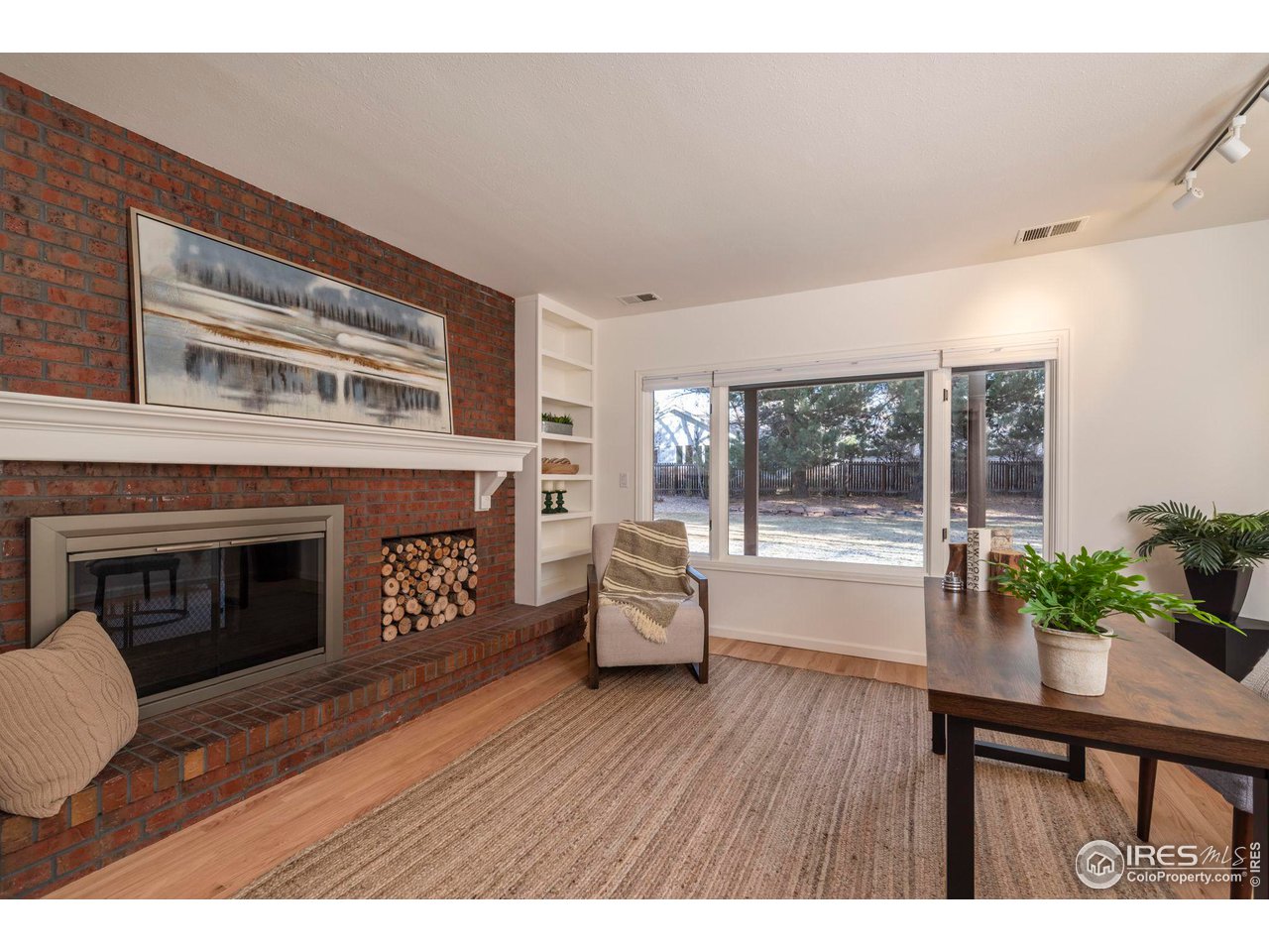 5332 Spotted Horse Trail Boulder, CO 80301 - Photo 18 of 40 a living room with furniture and a fireplace