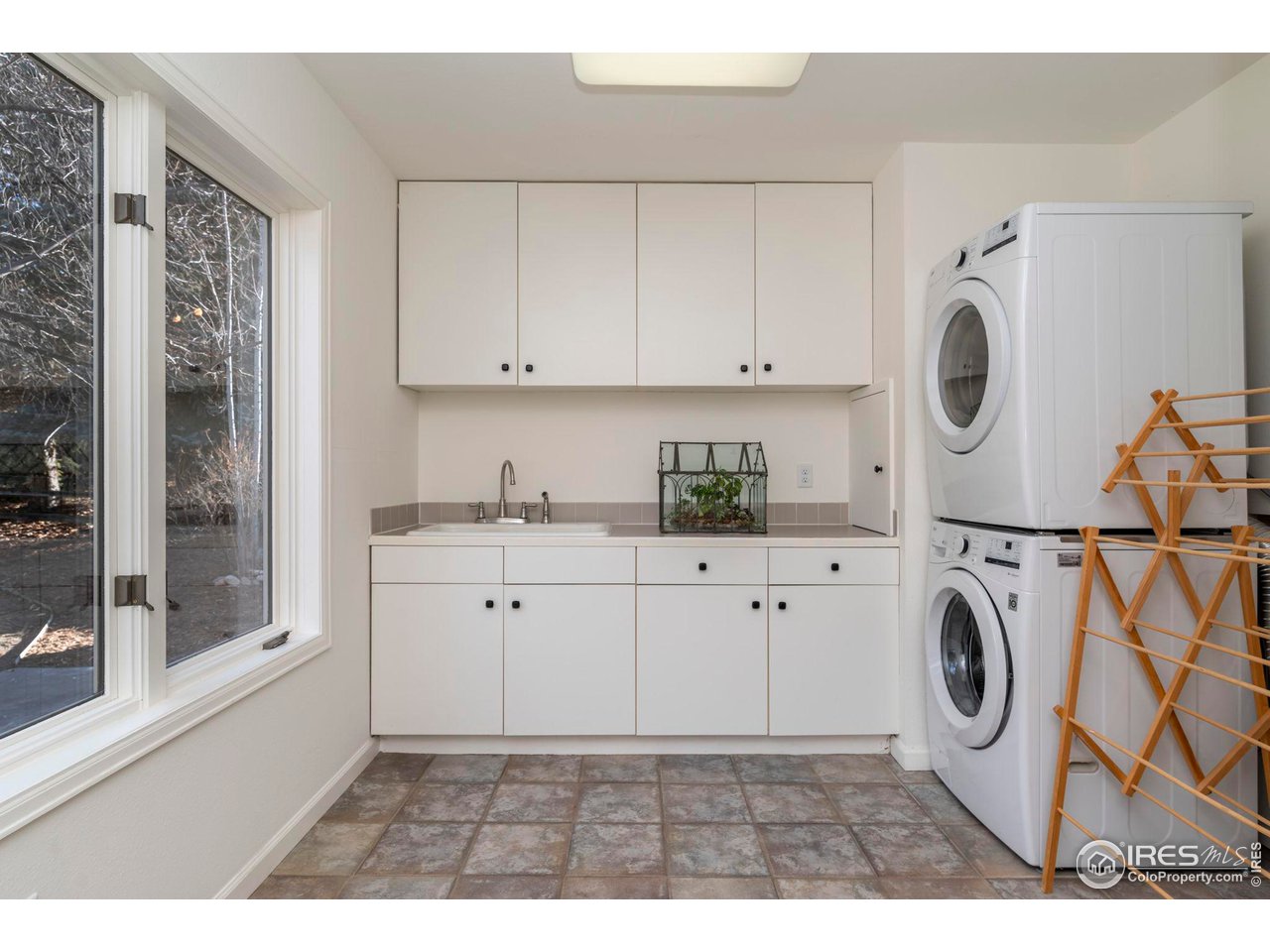 5332 Spotted Horse Trail Boulder, CO 80301 - Photo 21 of 40 a utility room with sink dryer and washer