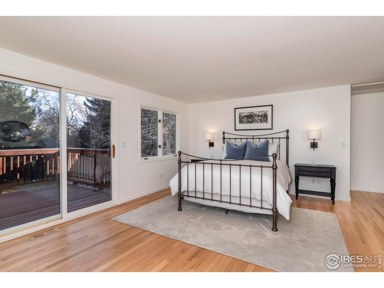 5332 Spotted Horse Trail Boulder, CO 80301 - Photo 23 of 40 a bedroom with furniture and window