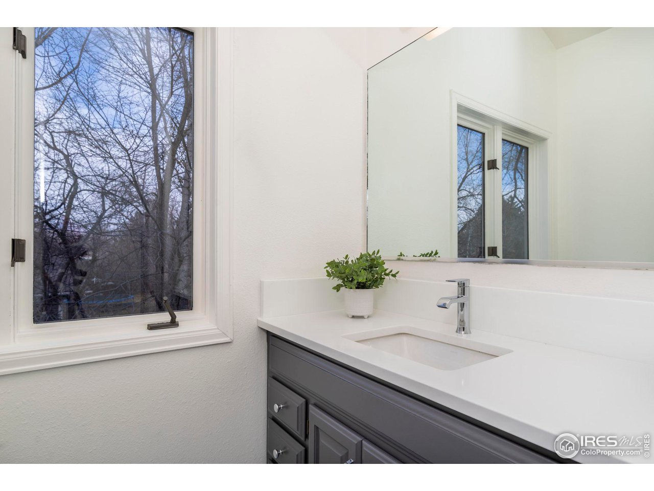 5332 Spotted Horse Trail Boulder, CO 80301 - Photo 32 of 40 a bathroom with a sink and a mirror