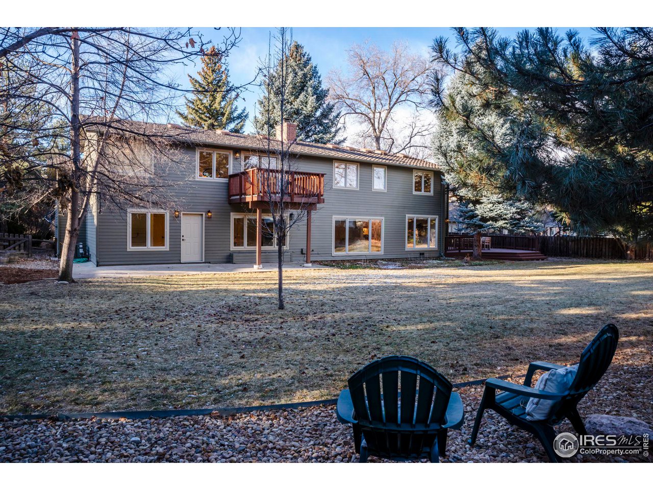 5332 Spotted Horse Trail Boulder, CO 80301 - Photo 34 of 40 a view of a house with a yard