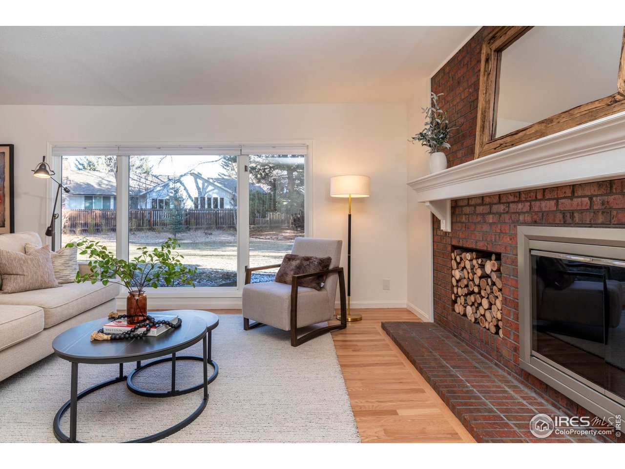 5332 Spotted Horse Trail Boulder, CO 80301 - Photo 4 of 40 a living room with furniture and a fireplace