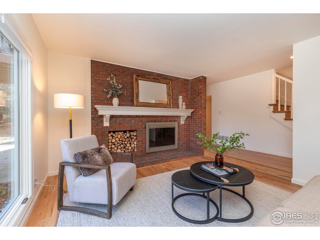 5332 Spotted Horse Trail Boulder, CO 80301 - Photo 5 of 40 a living room with furniture and a fireplace
